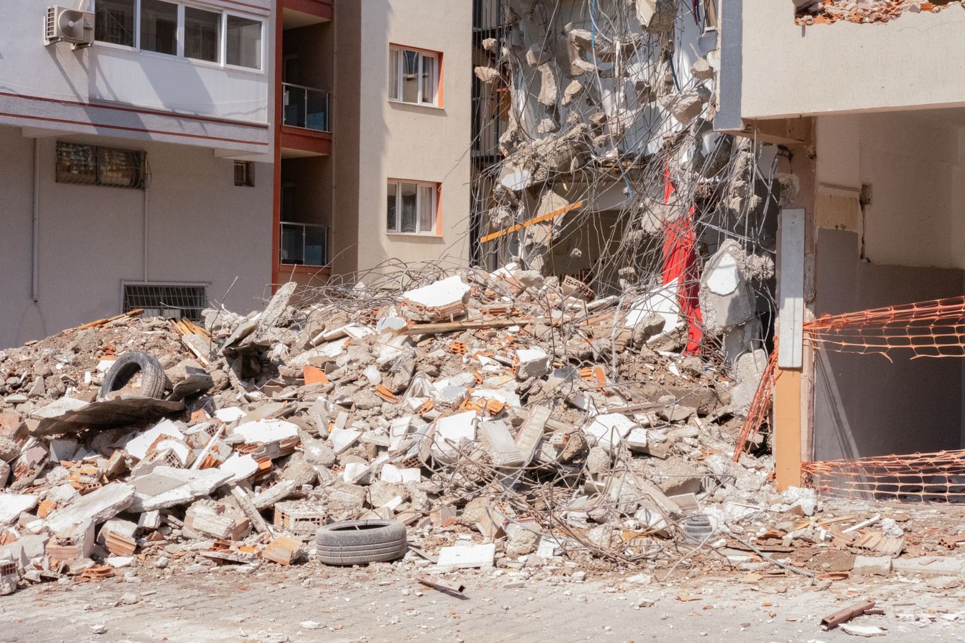 Rubble and debris piled at a building demolition